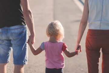 Family of three holding hands. Image: Pixabay.