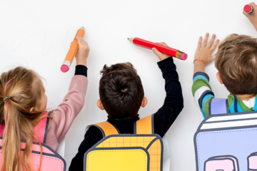 A diverse group of children drawing on a wall. Image: Pixabay.