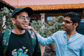 Two men talking. Image: Unsplash.